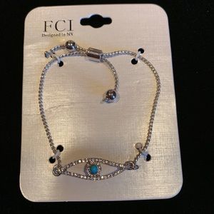 Silver Evil Eye bracelet with blue stone